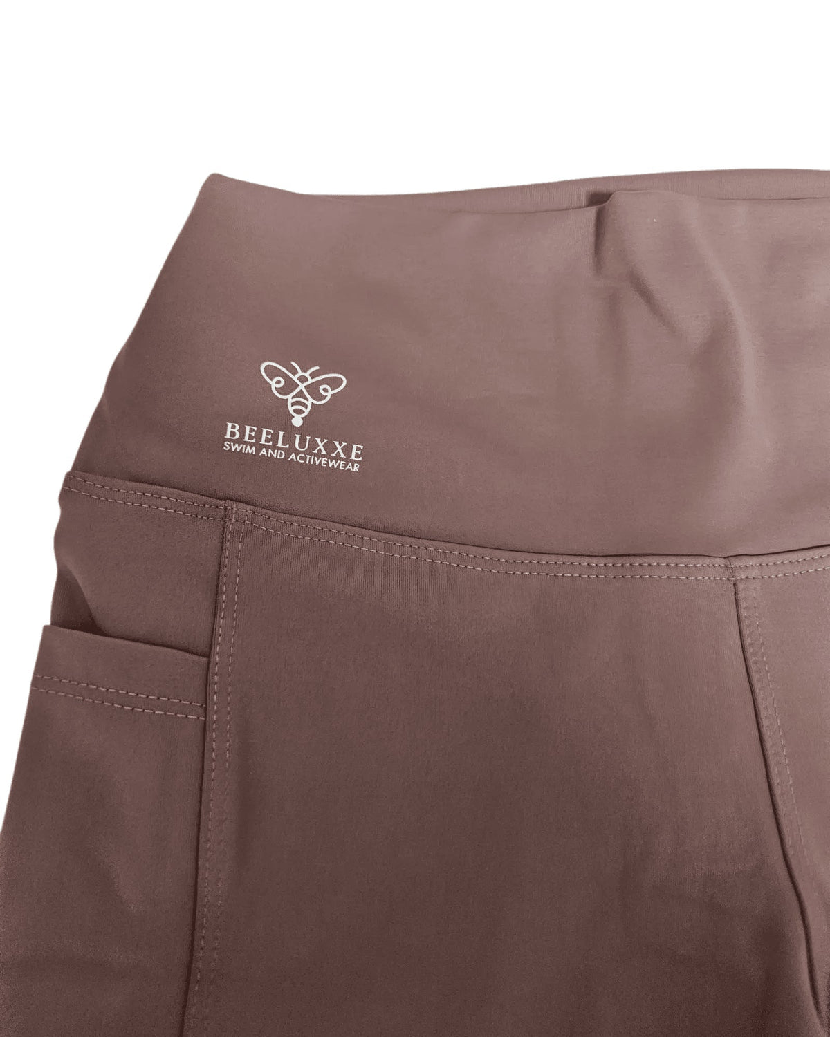 Evolve Pocket Legging in moccha, close-up of the high waistband and logo