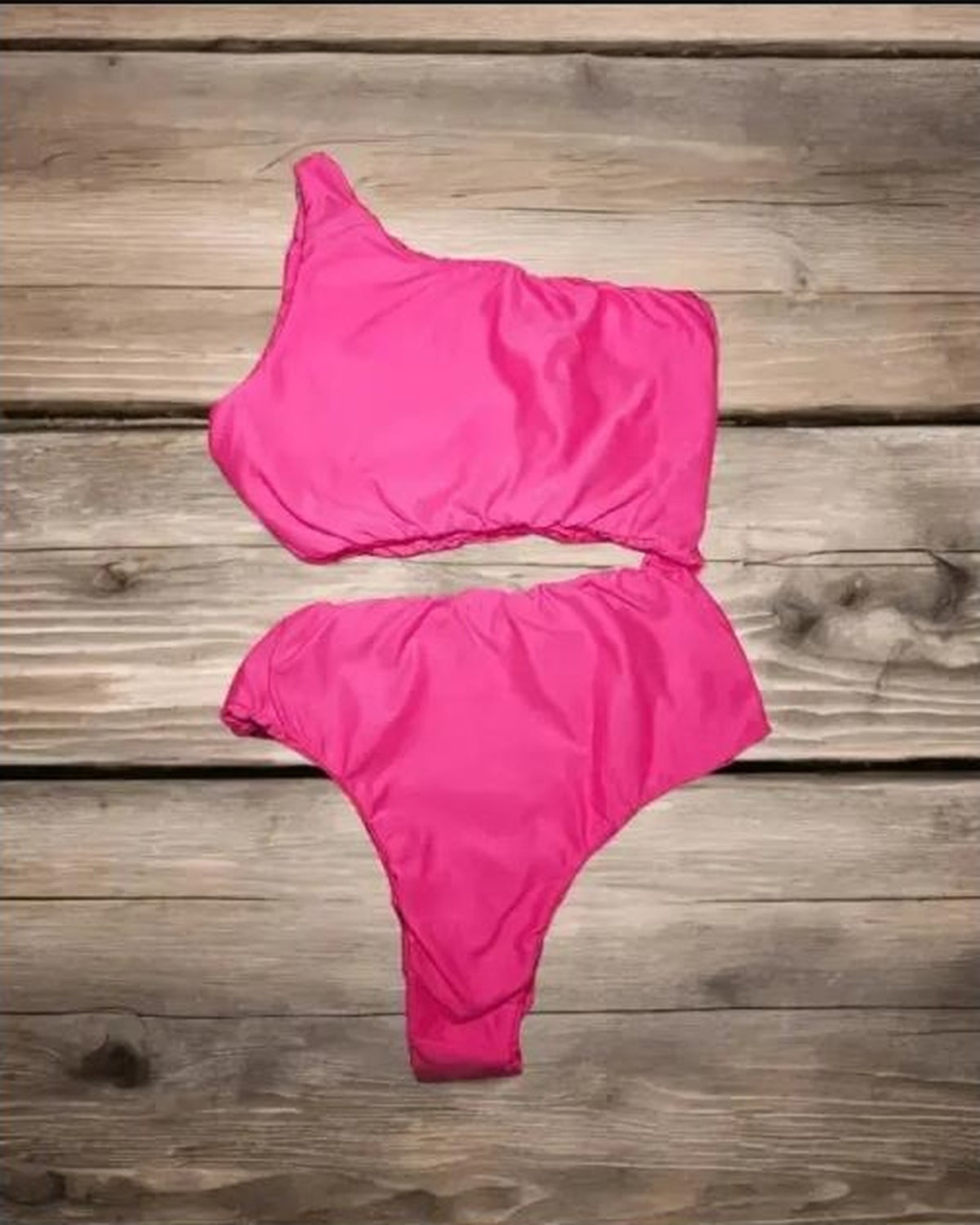 Beeluxxe Gloss One-Shoulder Bodysuit Swimsuit in pink, flat lay