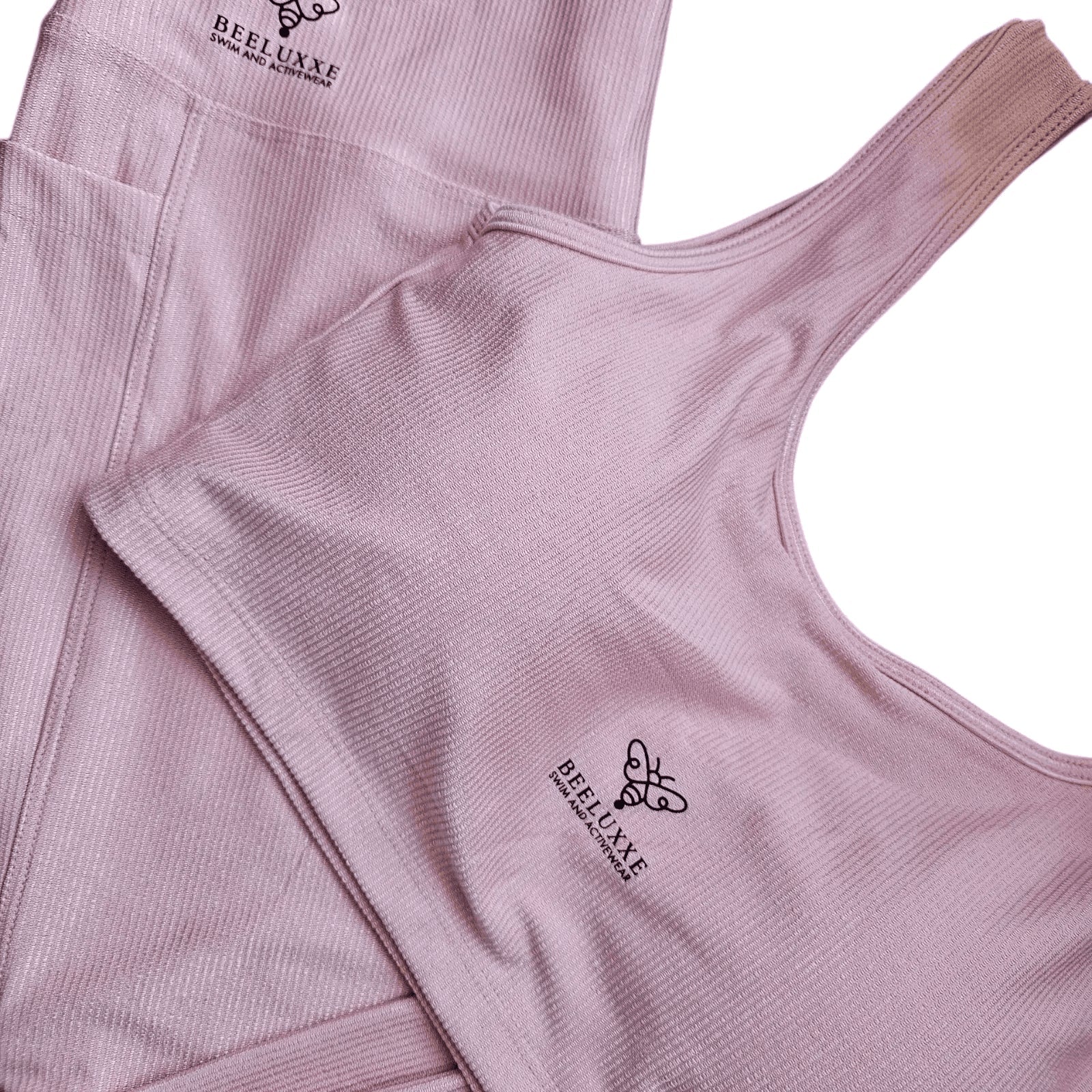 Luxxe Ribbed Legging in pink, close-up of the ribbed fabric with the matching top — Only 1 Left!